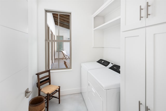 clothes washing area featuring separate washer and dryer