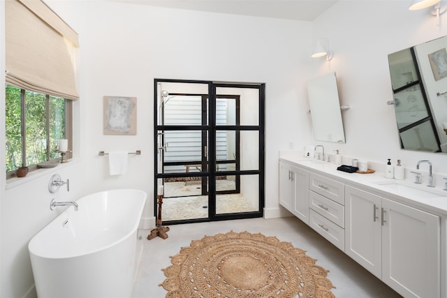 bathroom with a bathtub and vanity