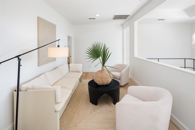 sitting room featuring light hardwood / wood-style floors