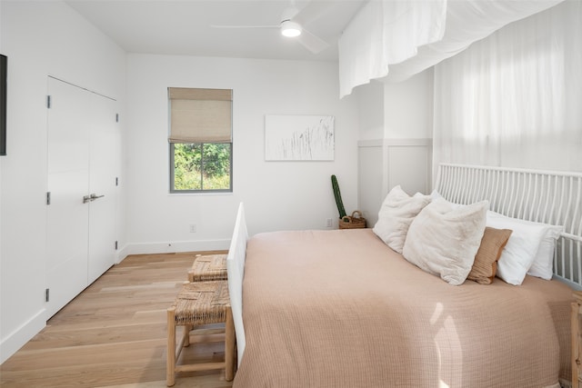 bedroom with ceiling fan and light hardwood / wood-style flooring