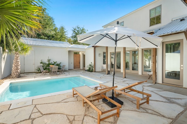 view of swimming pool featuring a patio area