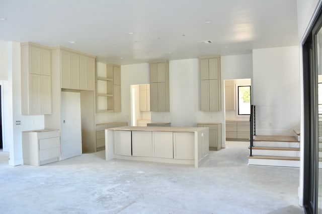 kitchen with cream cabinets and a kitchen island