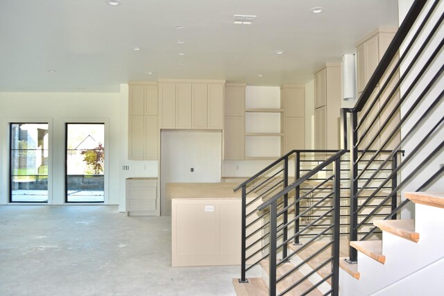 stairs with concrete floors