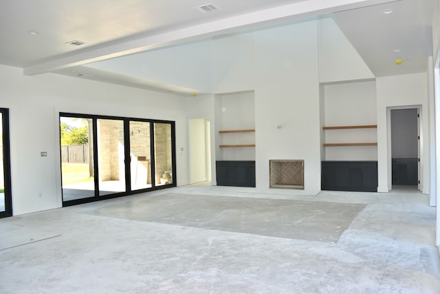 unfurnished living room with beamed ceiling, a towering ceiling, and concrete floors