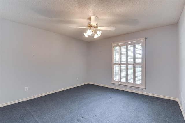 unfurnished room with ceiling fan, carpet floors, and a textured ceiling