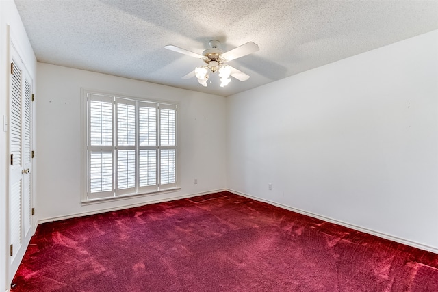 unfurnished room featuring ceiling fan, carpet, and a textured ceiling