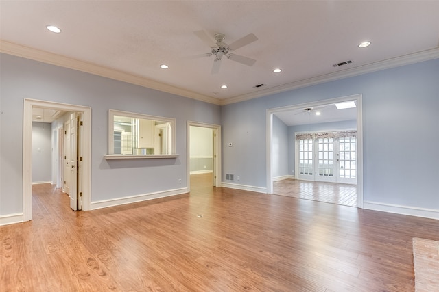 unfurnished living room with french doors, light hardwood / wood-style flooring, and ornamental molding