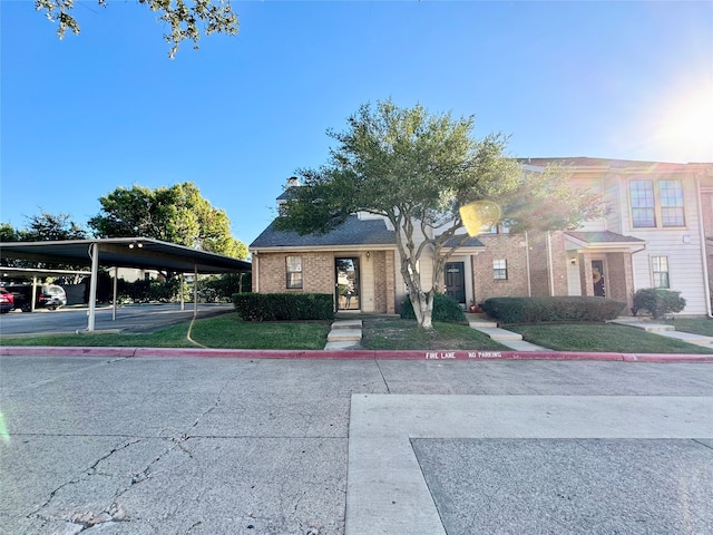 view of front of property featuring a carport