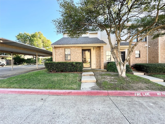 view of front of home featuring a carport