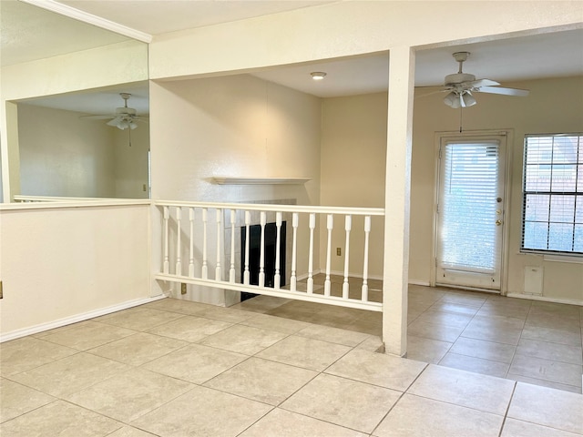 interior space with ceiling fan