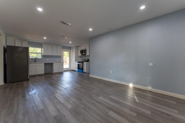 interior space featuring light wood-type flooring and sink