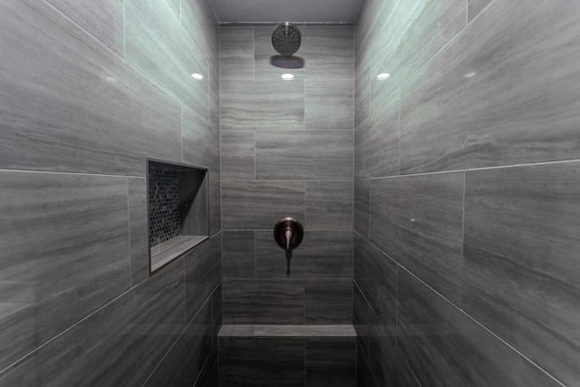 interior space featuring a tile shower