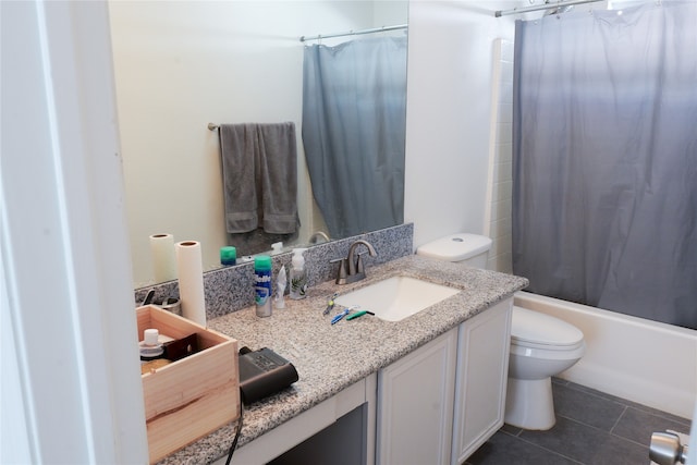 full bathroom with tile patterned flooring, shower / tub combo, vanity, and toilet