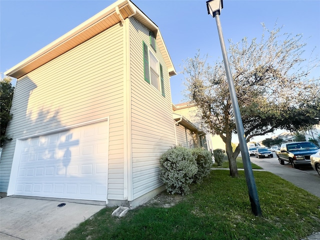 view of side of home featuring a garage