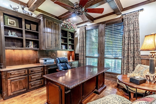 home office with coffered ceiling, ceiling fan, crown molding, light hardwood / wood-style flooring, and beamed ceiling