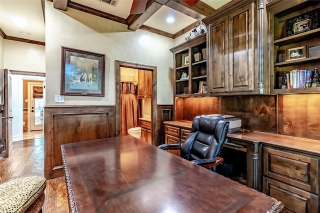 home office featuring built in shelves, coffered ceiling, light hardwood / wood-style flooring, beamed ceiling, and built in desk