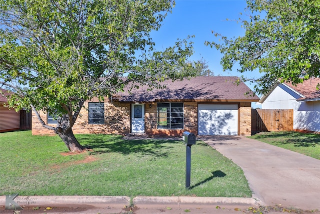 ranch-style house featuring a garage and a front lawn