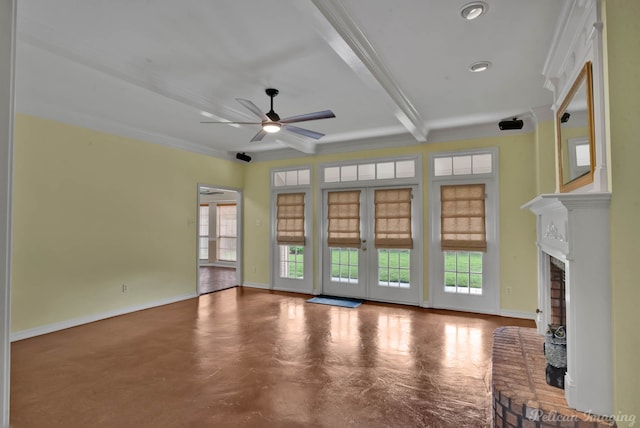 unfurnished living room with ceiling fan, a fireplace, a healthy amount of sunlight, and ornamental molding