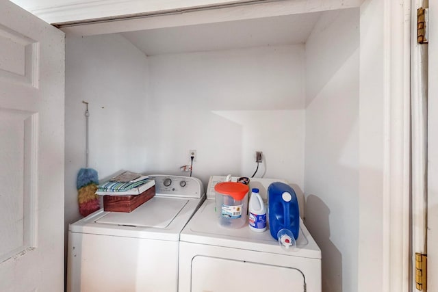 laundry room with separate washer and dryer