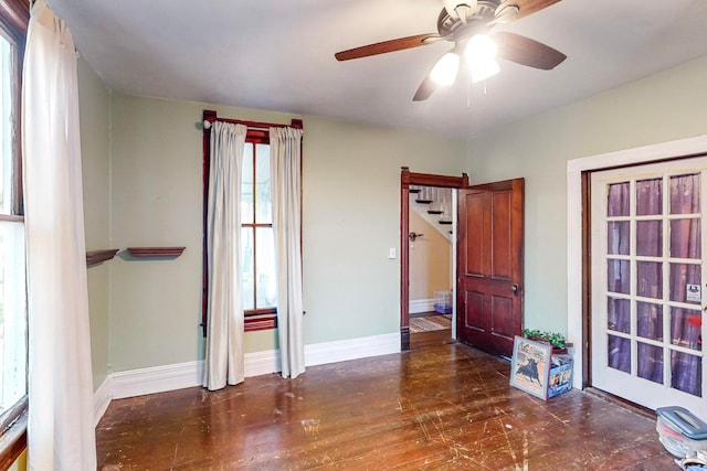 interior space featuring ceiling fan and dark hardwood / wood-style flooring