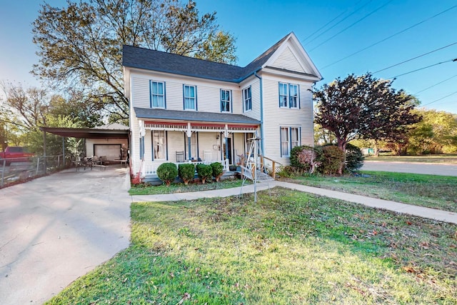 view of front property with a carport, a porch, and a front yard