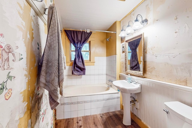 bathroom with toilet and wood-type flooring