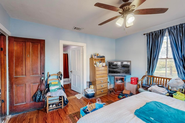 bedroom featuring hardwood / wood-style floors and ceiling fan