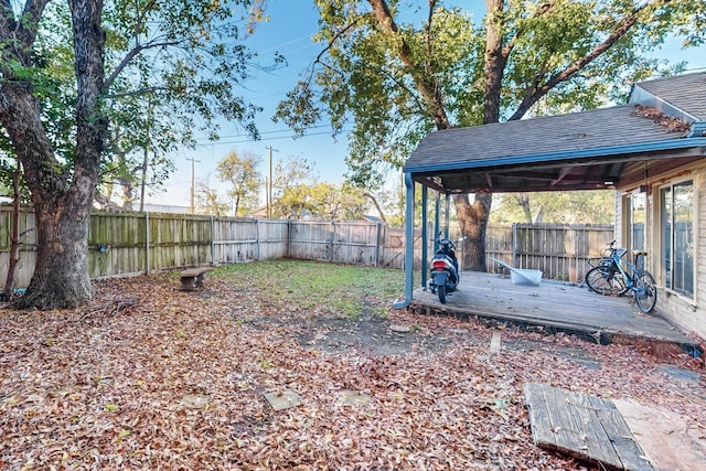 view of yard with a wooden deck