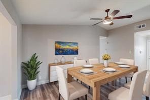 dining room featuring vaulted ceiling, ceiling fan, and dark hardwood / wood-style floors