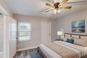 bedroom featuring ceiling fan and wood-type flooring