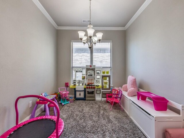 game room with carpet flooring, ornamental molding, and a chandelier