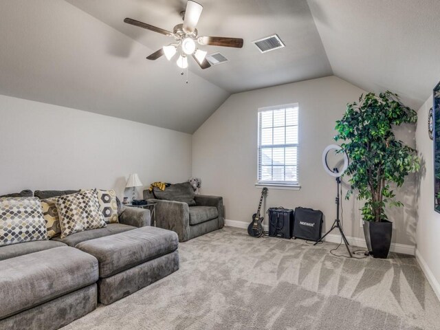 carpeted living room with vaulted ceiling and ceiling fan