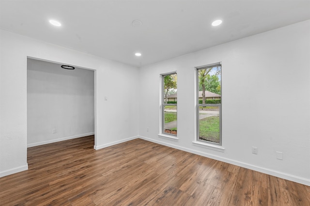 empty room with dark hardwood / wood-style floors