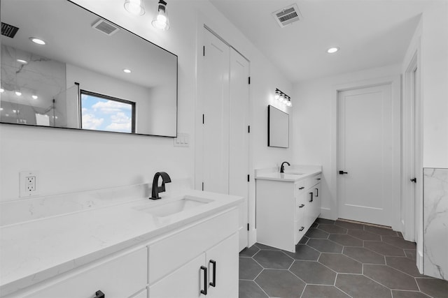 bathroom with vanity, tile patterned floors, and walk in shower