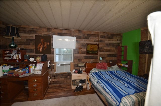 bedroom with dark hardwood / wood-style flooring, wooden ceiling, cooling unit, and wooden walls