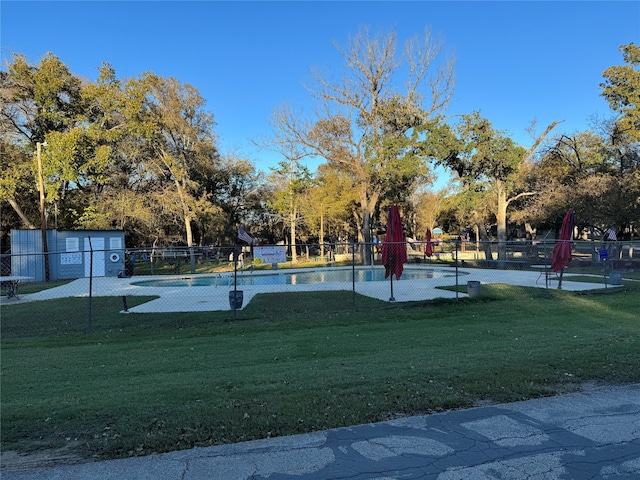 view of home's community featuring a lawn