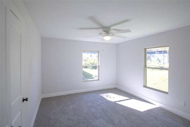 spare room with ceiling fan and carpet floors