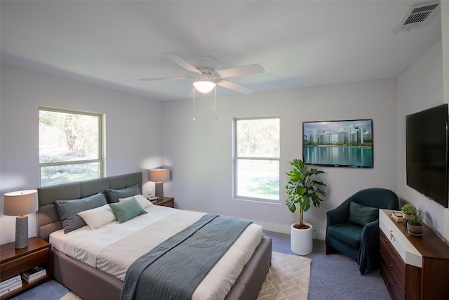 carpeted bedroom featuring ceiling fan