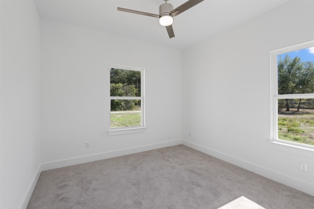 carpeted empty room with ceiling fan