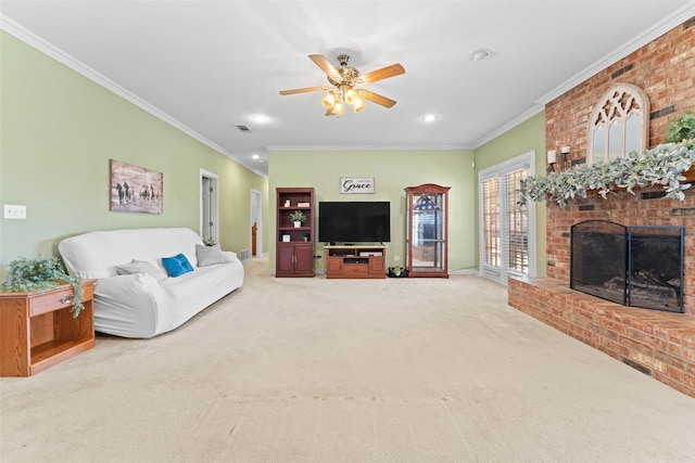 carpeted living room featuring visible vents, a ceiling fan, ornamental molding, and a fireplace