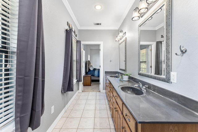 bathroom featuring tile patterned floors, vanity, and crown molding