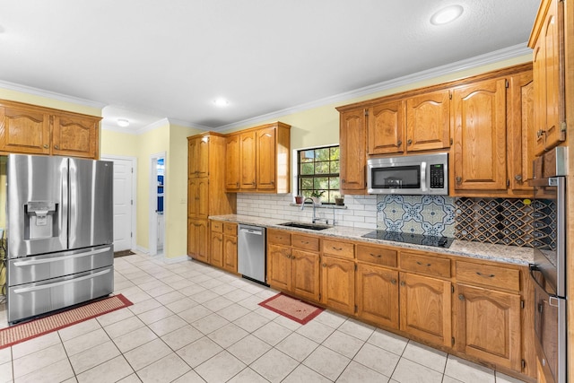 kitchen with stainless steel appliances, ornamental molding, and sink