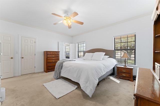 bedroom featuring light carpet, a ceiling fan, and crown molding