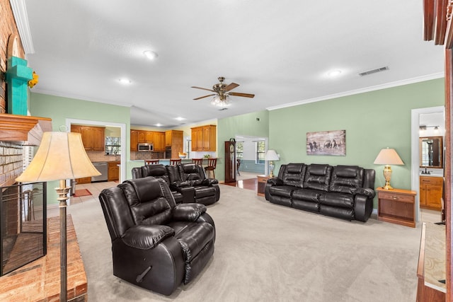 carpeted living room featuring ceiling fan and ornamental molding