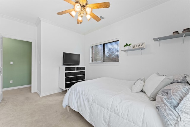 bedroom featuring visible vents, light carpet, crown molding, baseboards, and ceiling fan