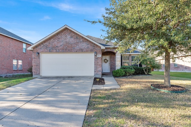 view of front of house with a front yard and a garage