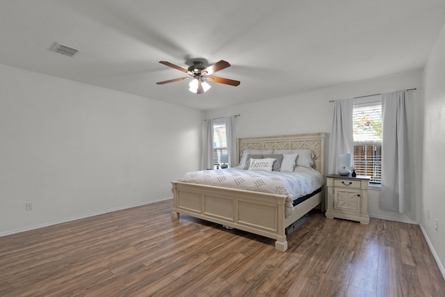 bedroom with ceiling fan and dark wood-type flooring