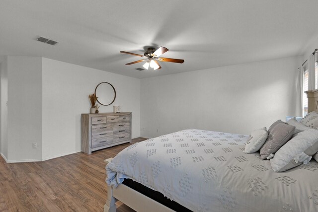 bedroom with hardwood / wood-style floors and ceiling fan