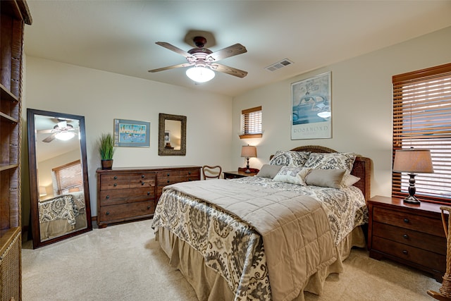 bedroom featuring ceiling fan and light colored carpet