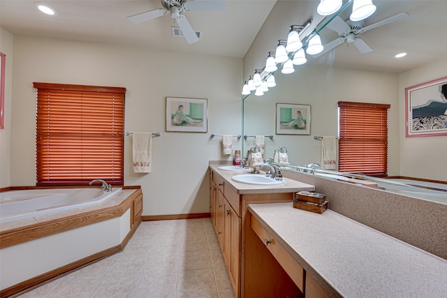 bathroom featuring tile patterned flooring, vanity, a relaxing tiled tub, and ceiling fan